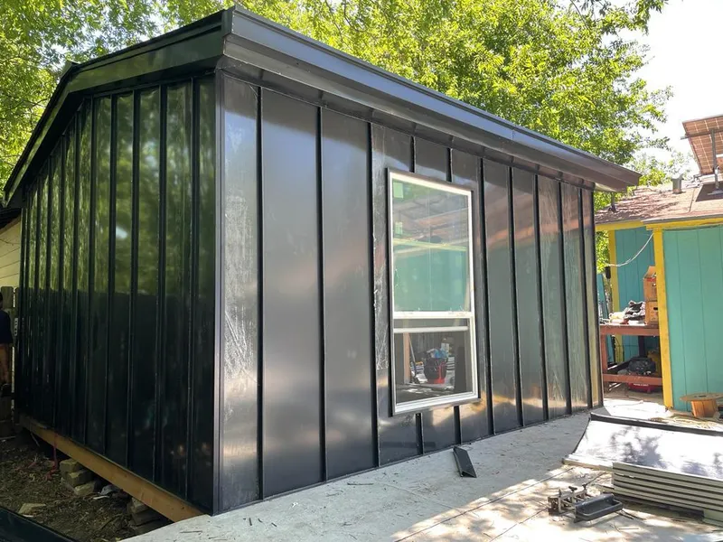 Black standing seam metal wall panels for Roof Inspection in Island Lake