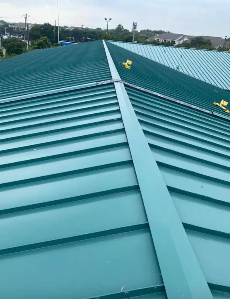 Green commercial metal roof ridge and valley for Metal Roof Repair in Island Lake